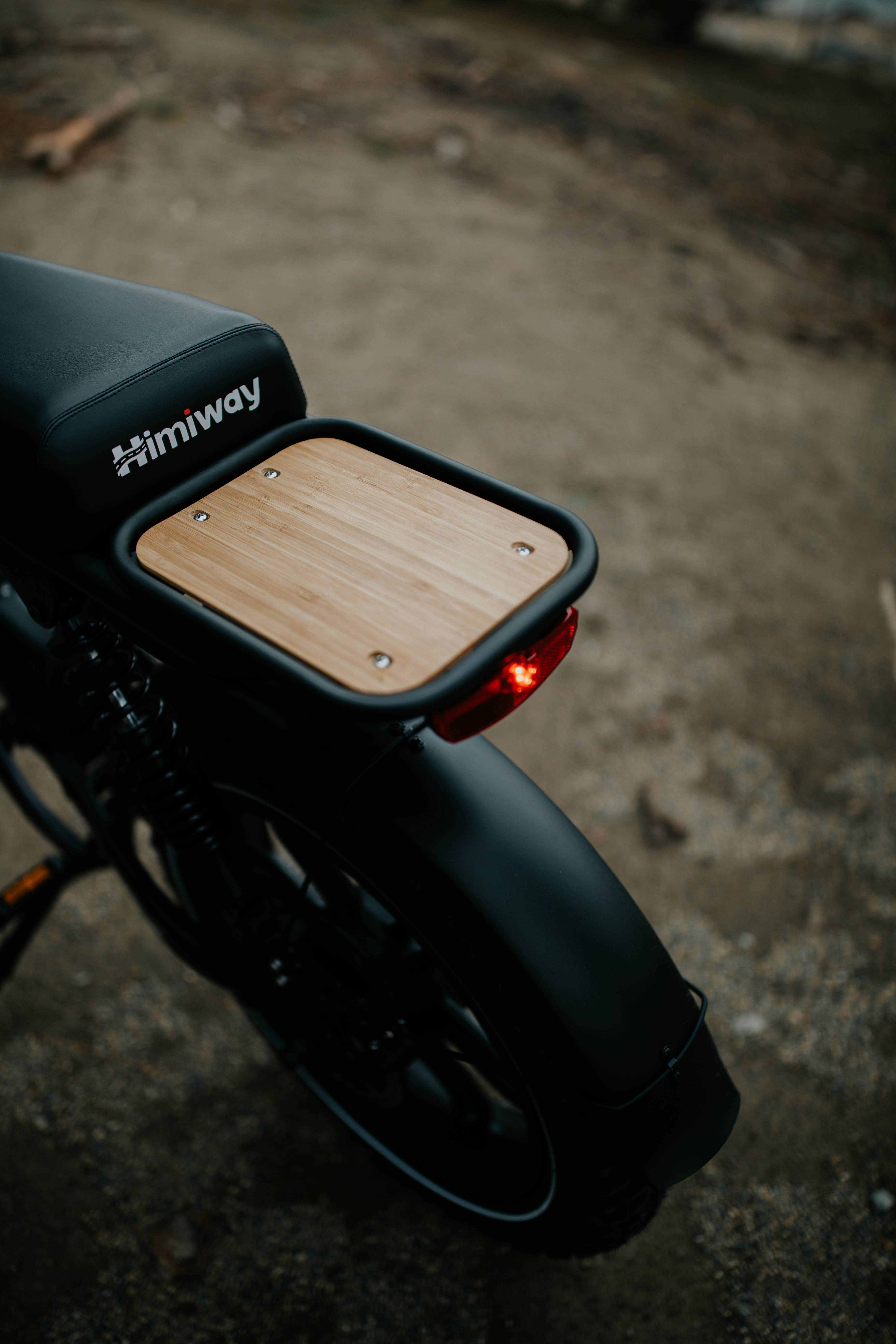 black motorcycle with brown wooden board