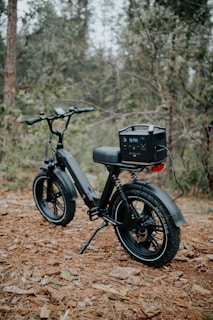 black and gray motorcycle parked on brown dirt road during daytime