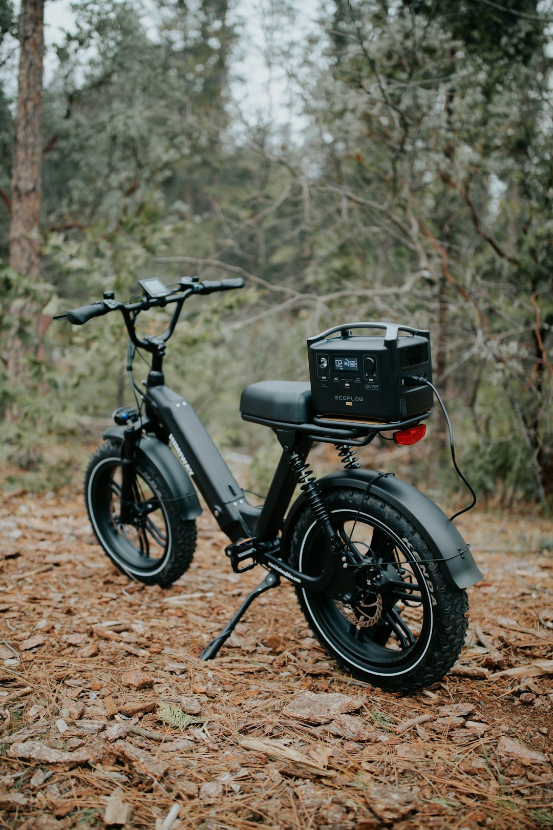 black and gray motorcycle parked on brown dirt road during daytime