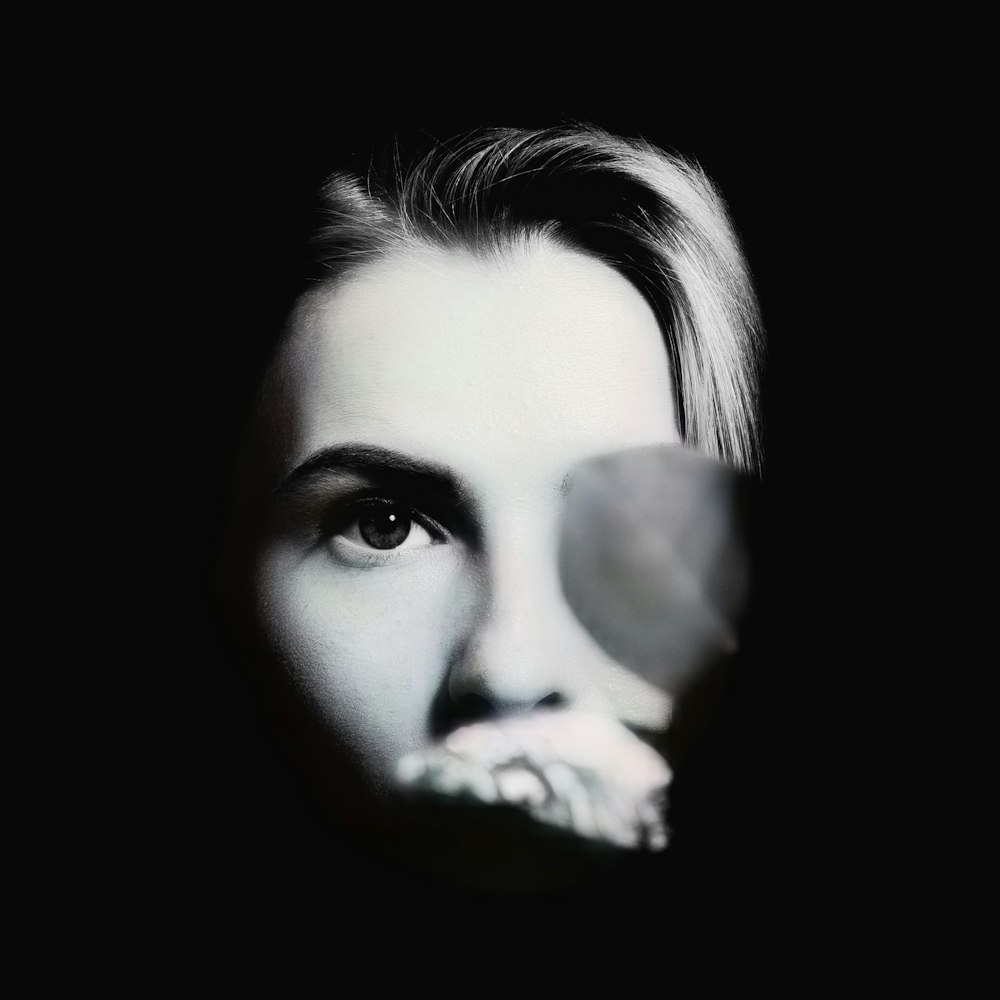 womans face with black background