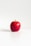 red apple on white surface