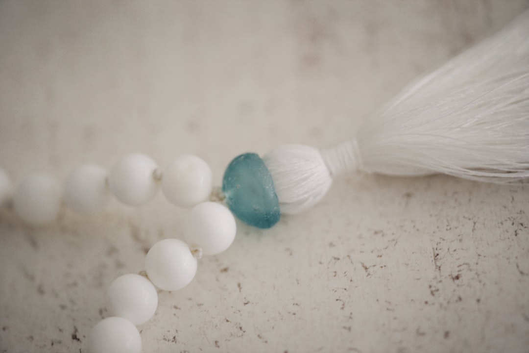 white and teal beaded necklace