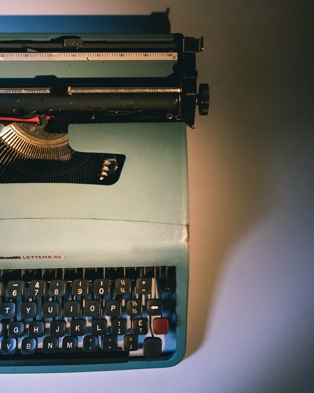 black and gray typewriter on white table