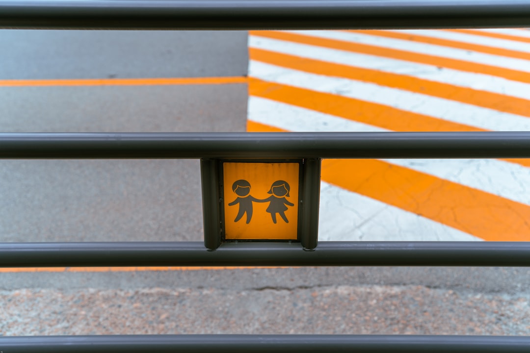 black wooden bench with yellow and black arrow sign