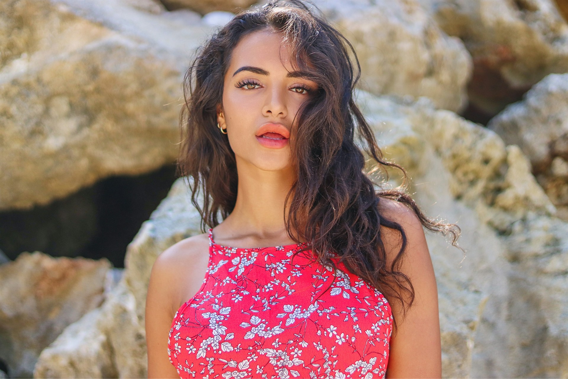 woman in red and white floral spaghetti strap top