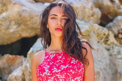 woman in red and white floral spaghetti strap top