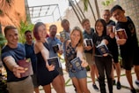 group of people standing near green plant