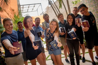 group of people standing near green plant