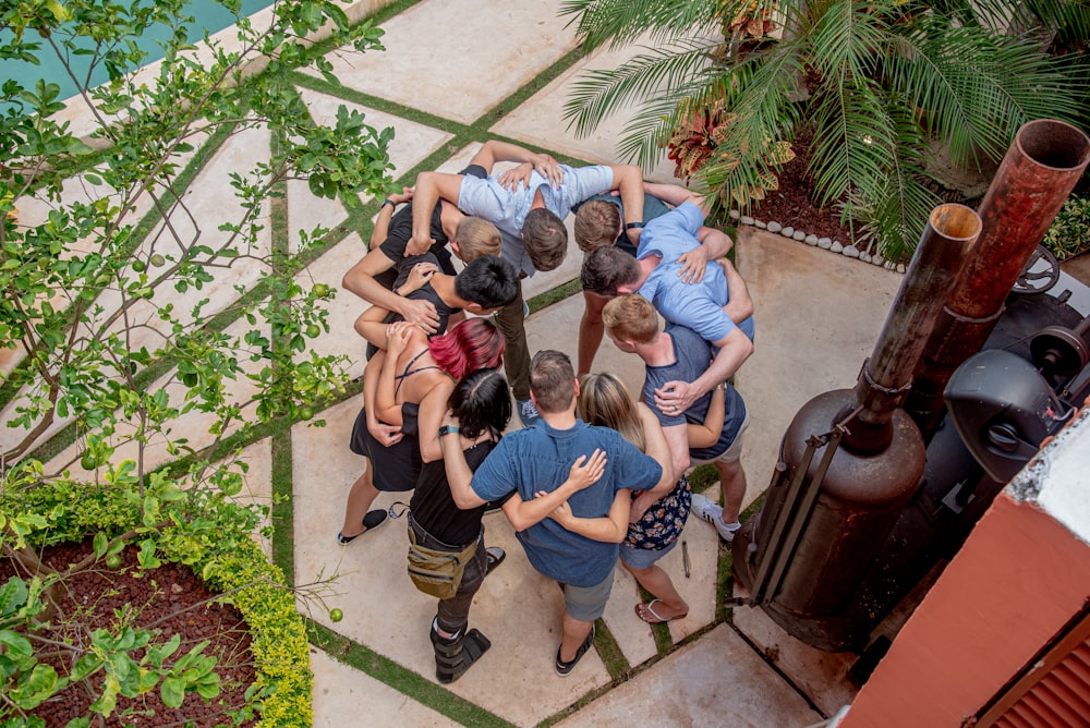 group of people sitting on concrete floor