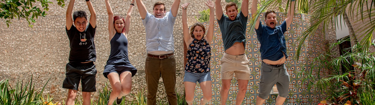 group of people standing on gray concrete floor during daytime