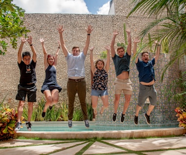 group of people standing on gray concrete floor during daytime