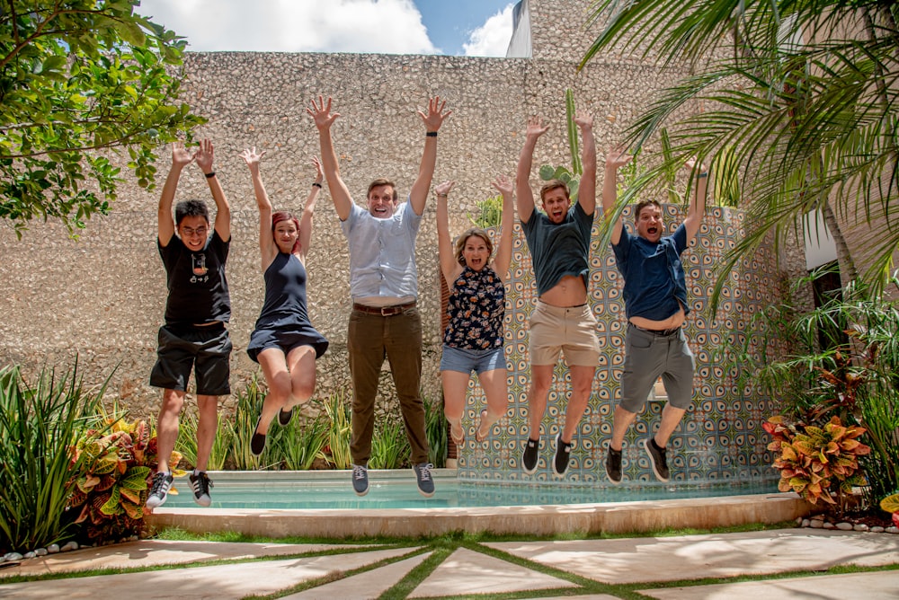 group of people standing on gray concrete floor during daytime