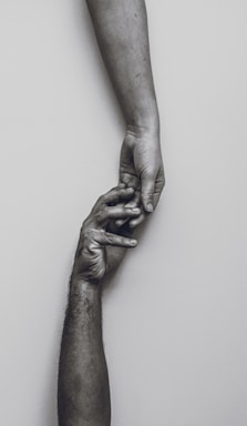 grayscale photo of persons hand