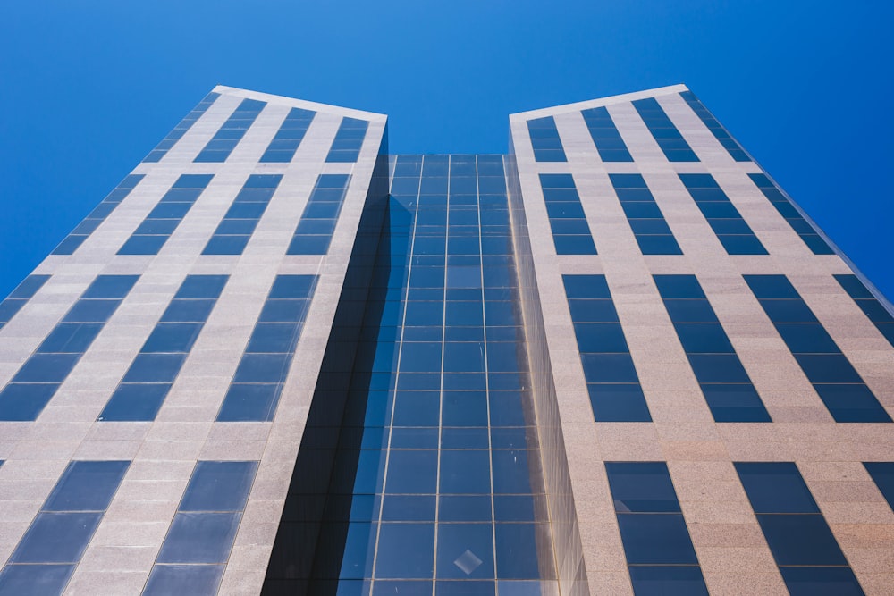 white and blue concrete building under blue sky during daytime