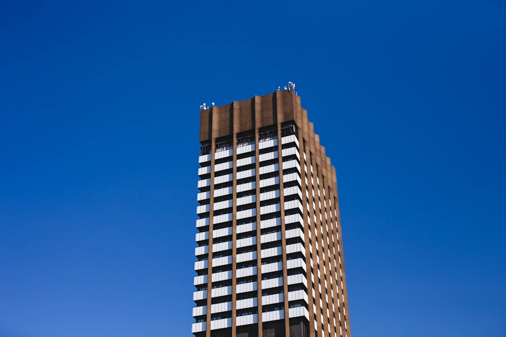 brown concrete building under blue sky during daytime