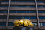 Close-up of a rhinoceros sculpture symbolizing strength and stability in a luxury lobby.