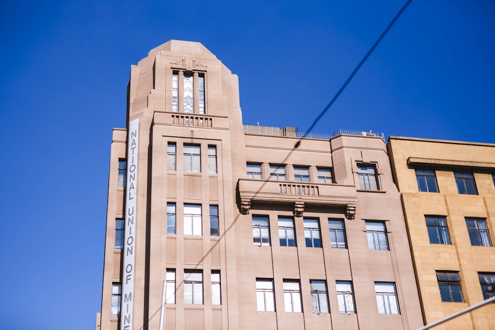 brown concrete building under blue sky during daytime