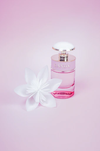 pink perfume bottle with white flower