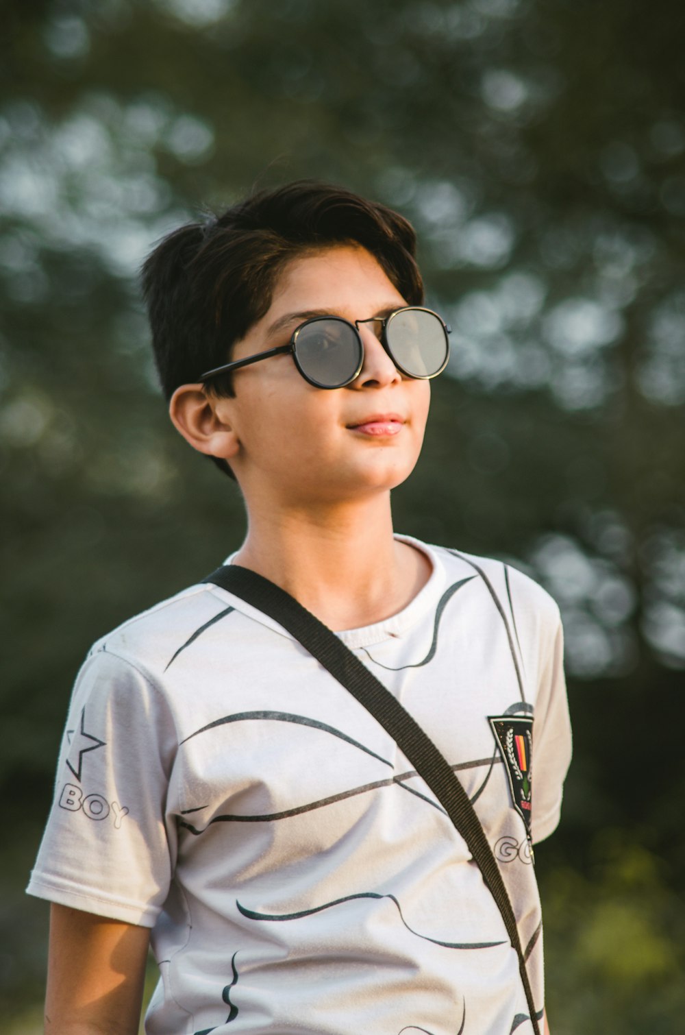 man in white crew neck shirt wearing black framed eyeglasses