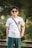 man in white crew neck t-shirt wearing black sunglasses