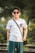 man in white crew neck t-shirt wearing black sunglasses