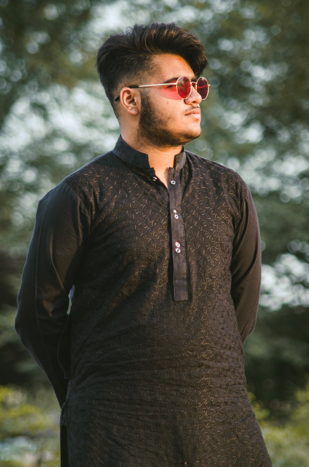 man in black dress shirt wearing sunglasses