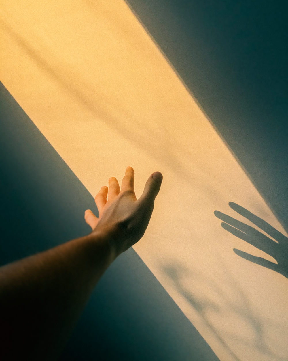 persons left hand on white textile