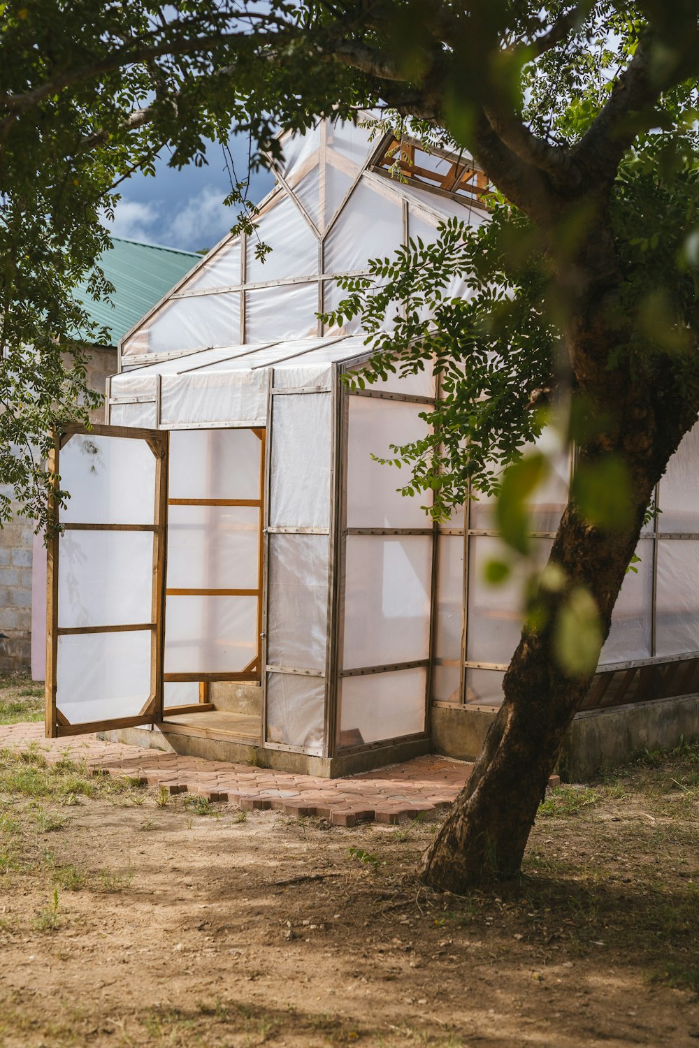 white and brown wooden shed