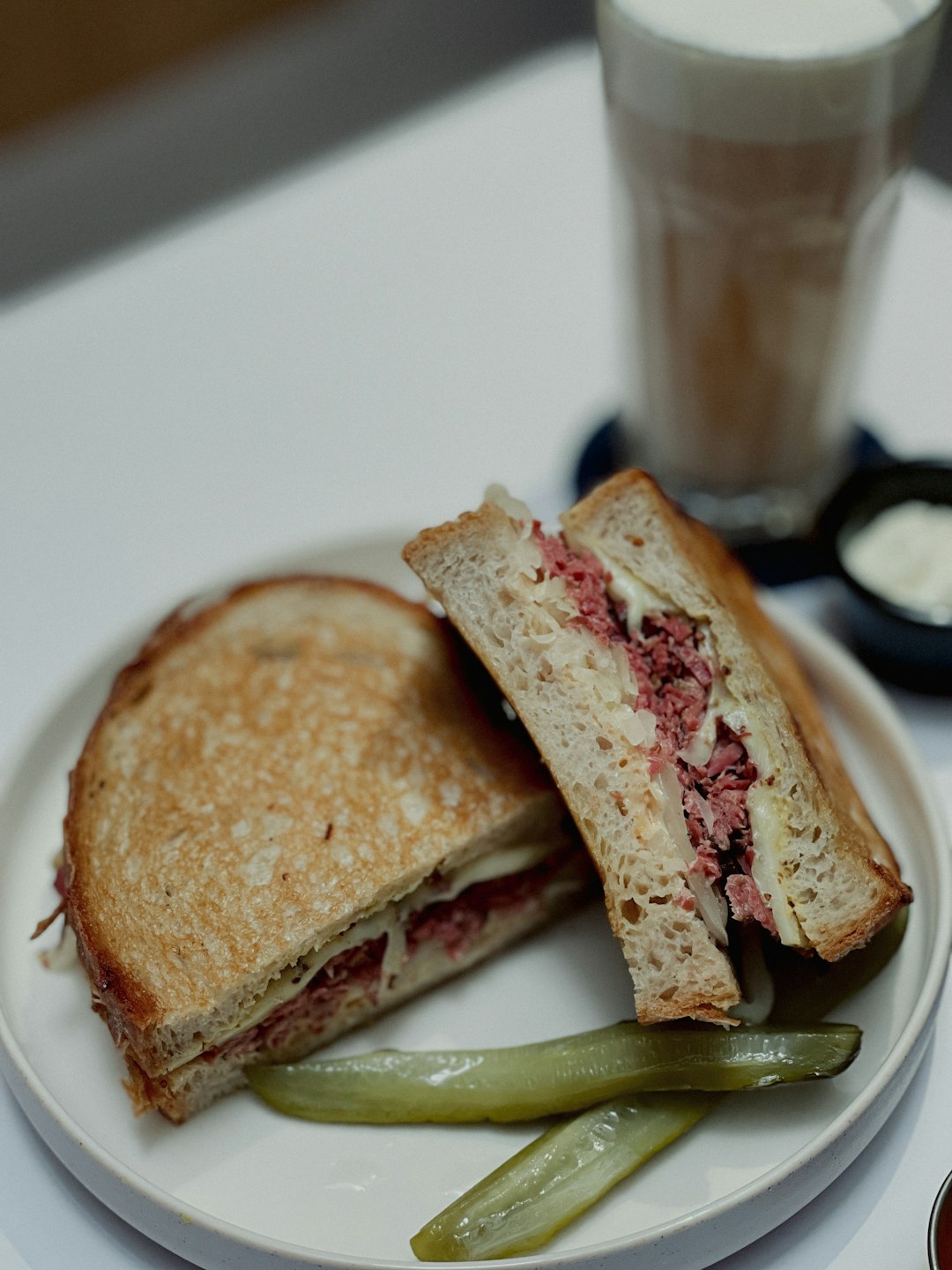 bread with ham and cheese on white ceramic plate