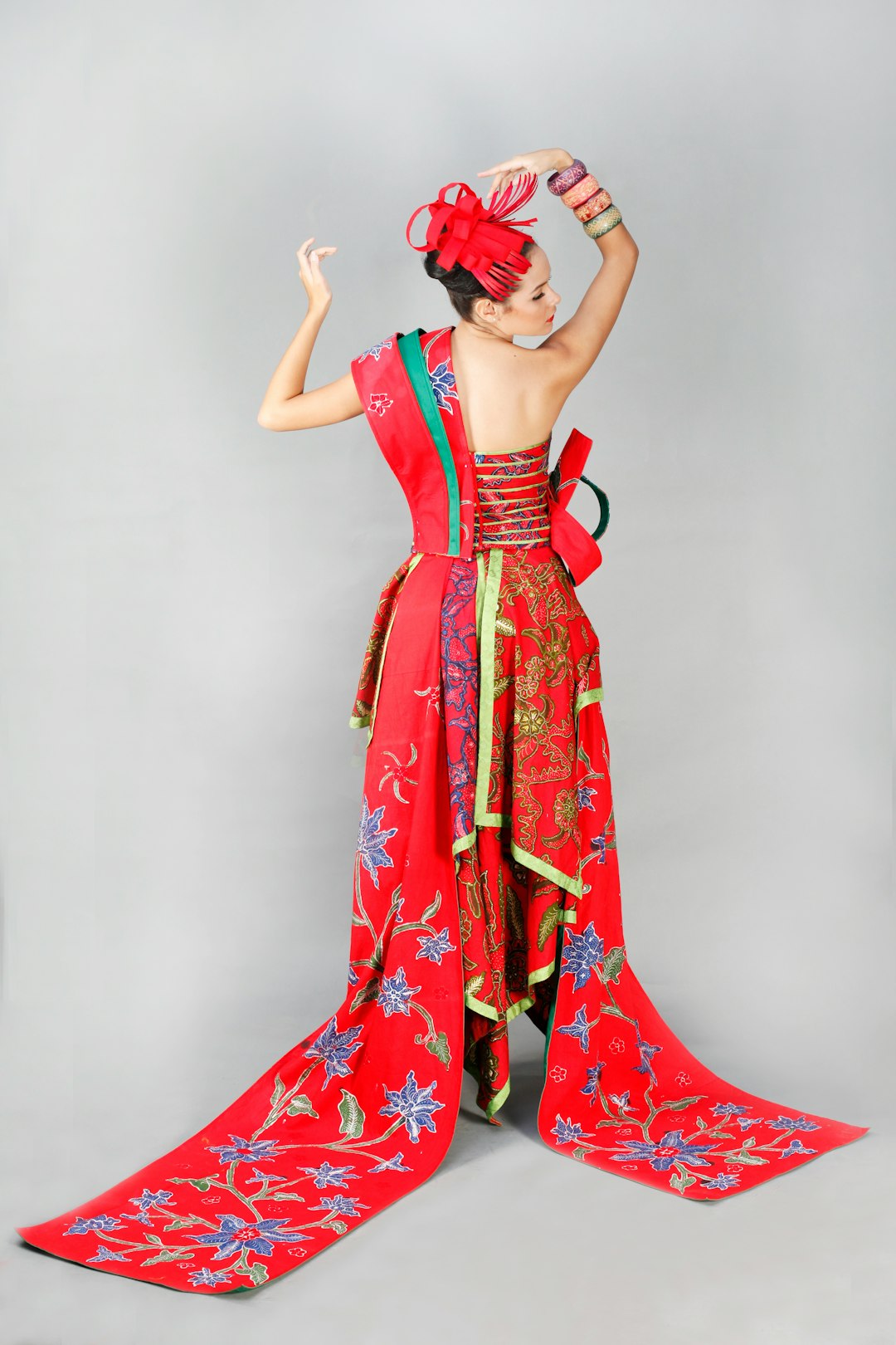 woman in red and white floral dress