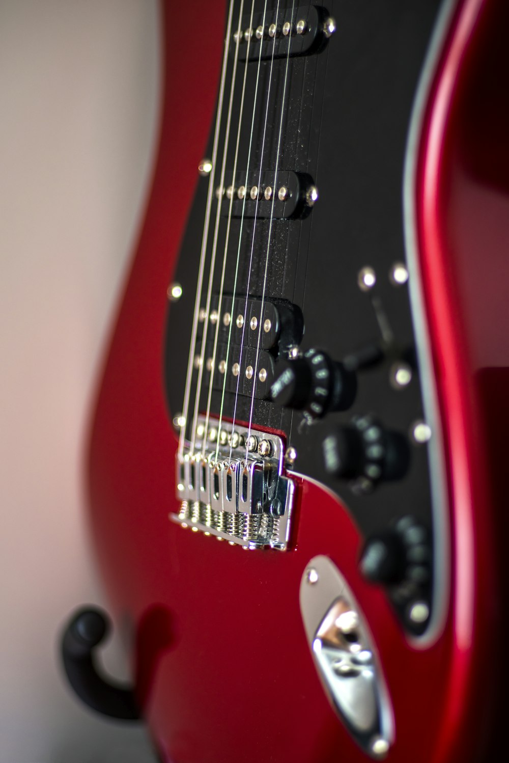 red and black electric guitar