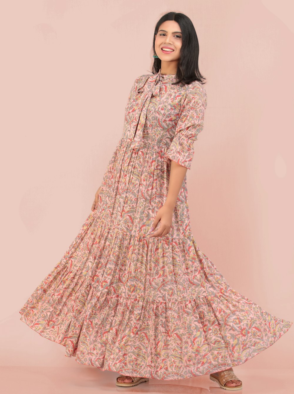 woman in pink and white floral dress