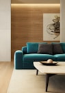blue sofa beside brown wooden table