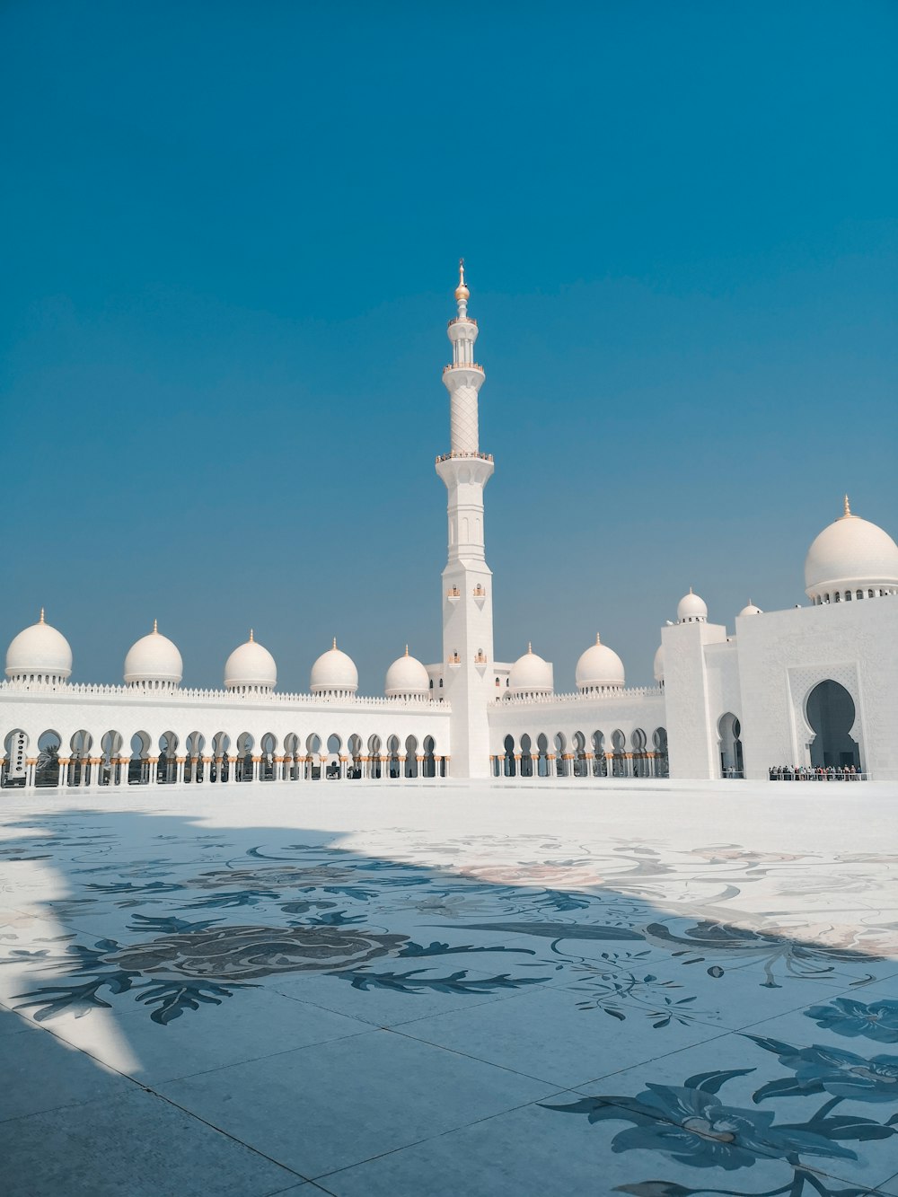 white mosque under blue sky during daytime