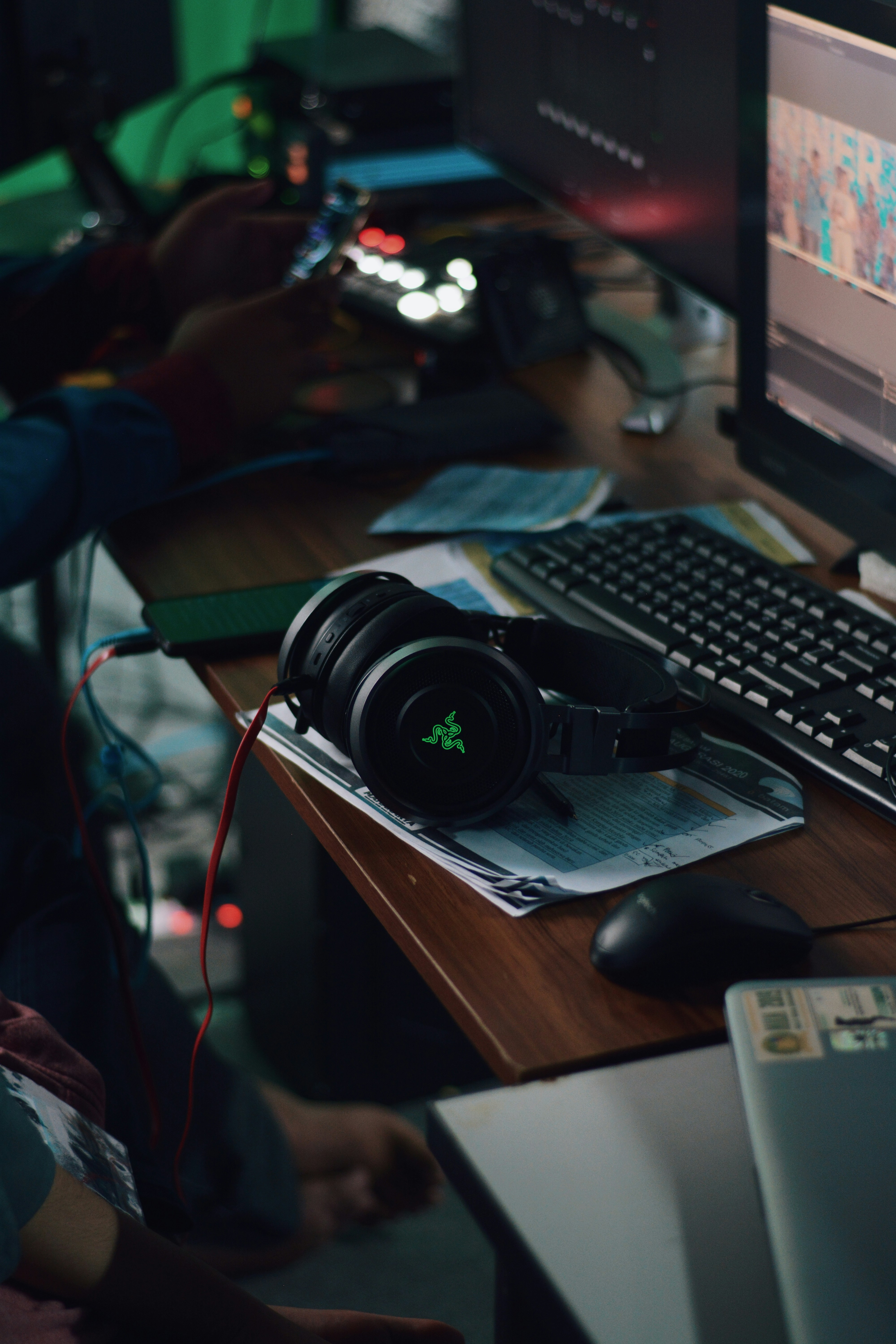Acer Predator Helios 300 gaming laptop with green accents open on desk