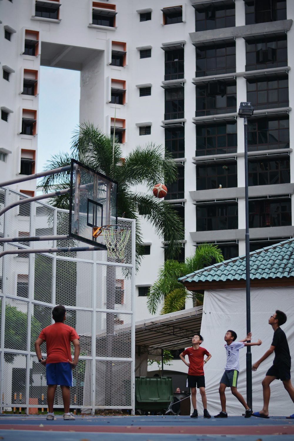 people standing near white concrete building during daytime