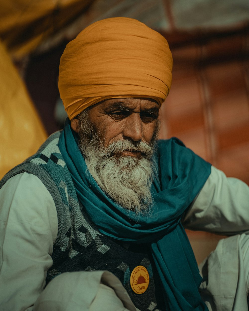 man in yellow turban and blue long sleeve shirt