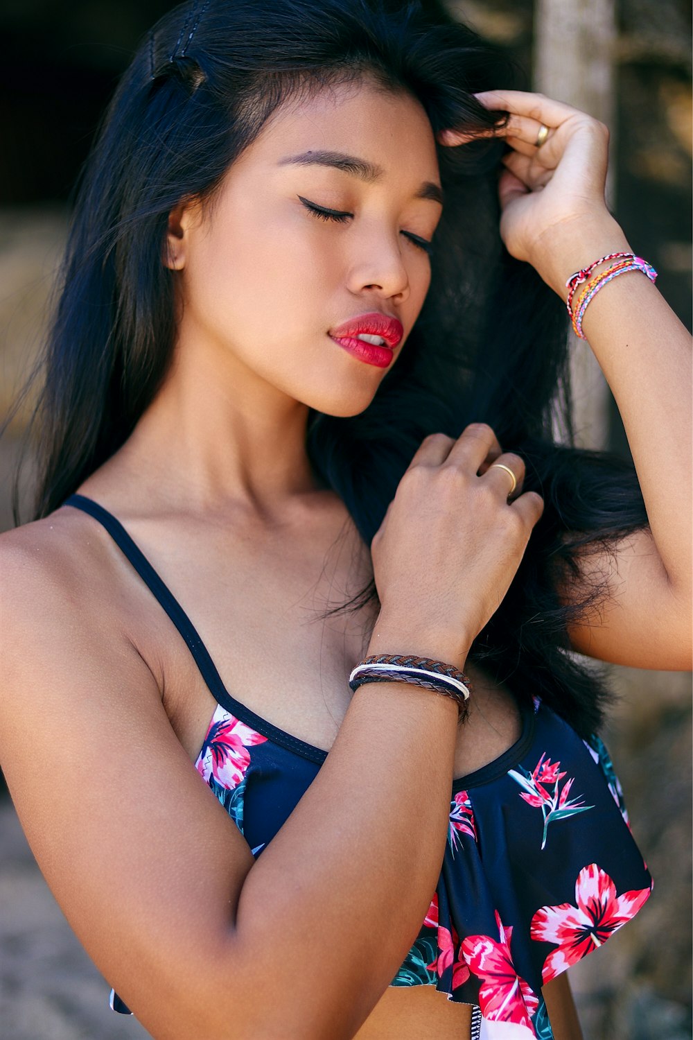 woman in black and pink floral tank top