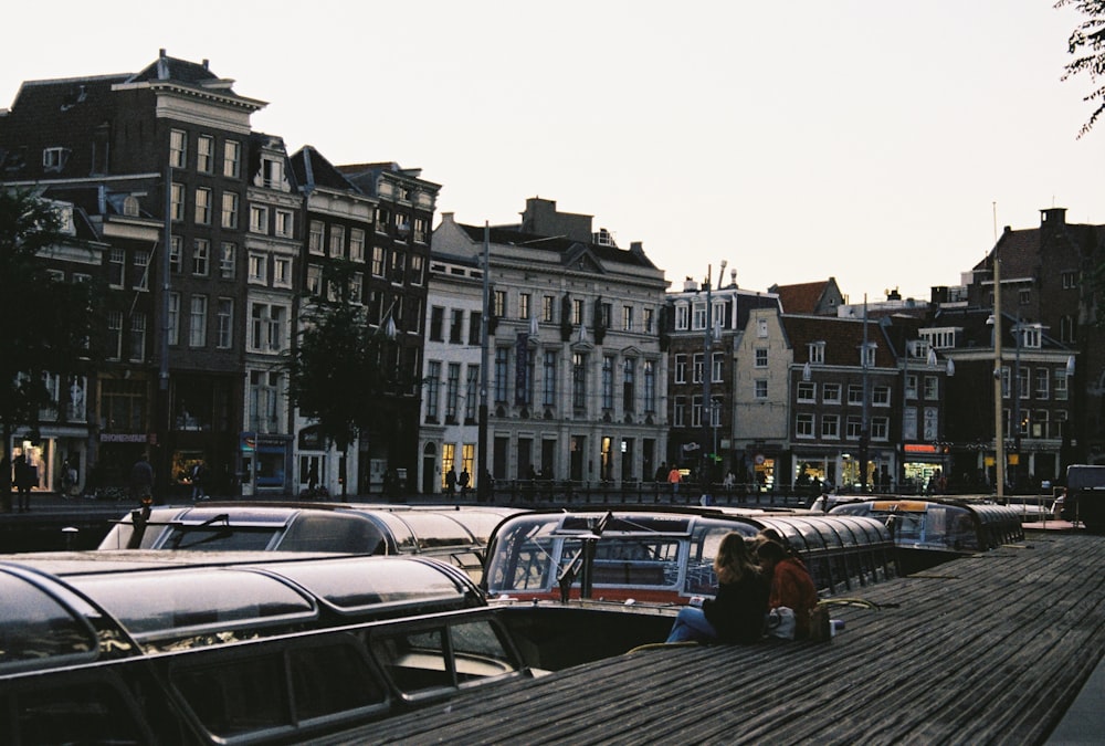 cars parked on sidewalk near buildings during daytime