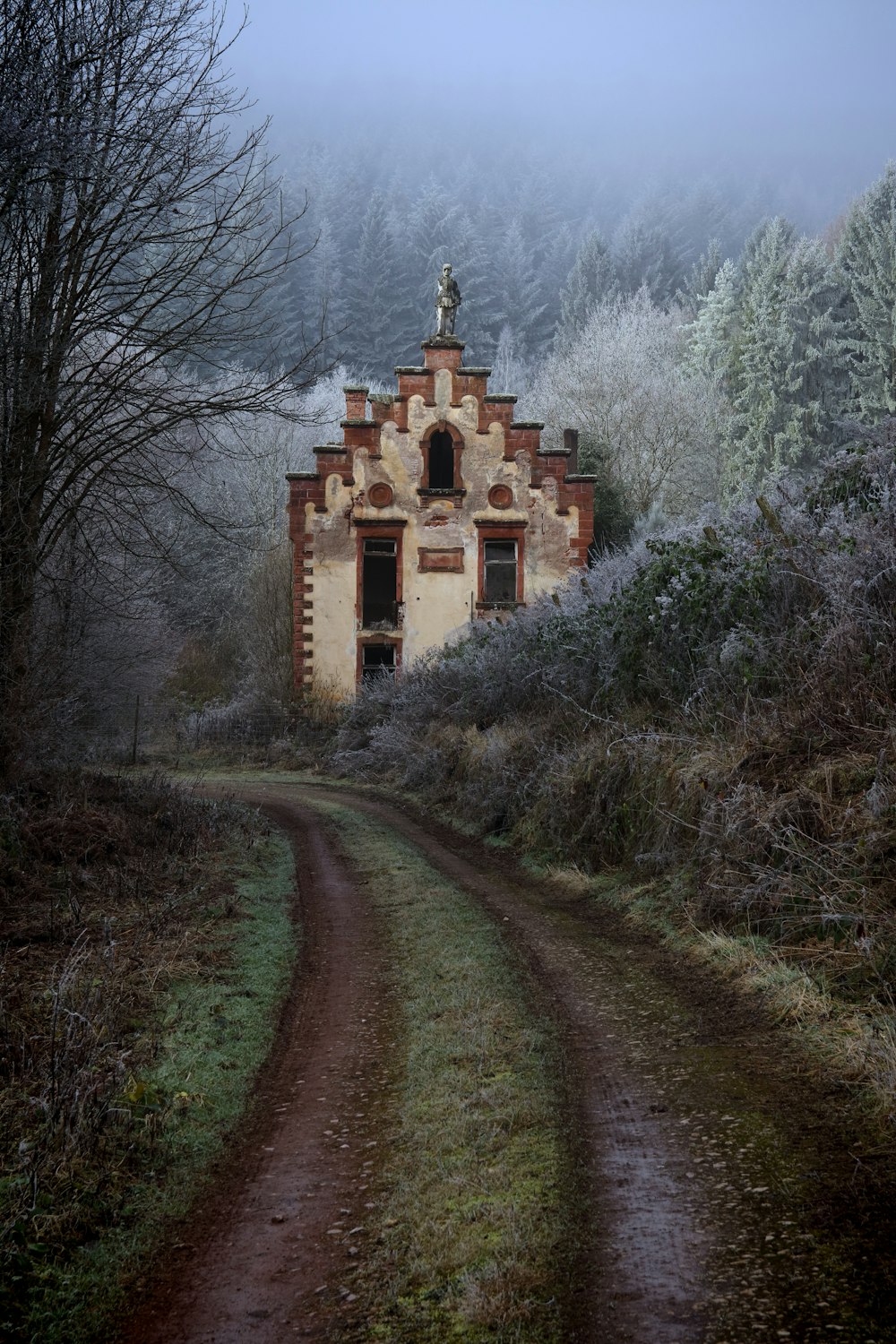 brown concrete building surrounded by trees