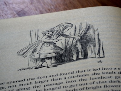 An illustration on a book page depicts a young girl with long hair and a dress peeking through curtains into a small door. The scene appears to be from a classic storybook, showcasing intricate line work and detail.