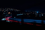 time lapse photography of cars on road during night time