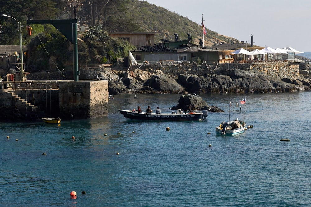 people riding on boat on body of water during daytime