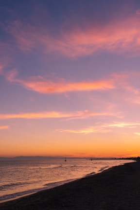 A scenic view of the beach in Gąski during sunset.