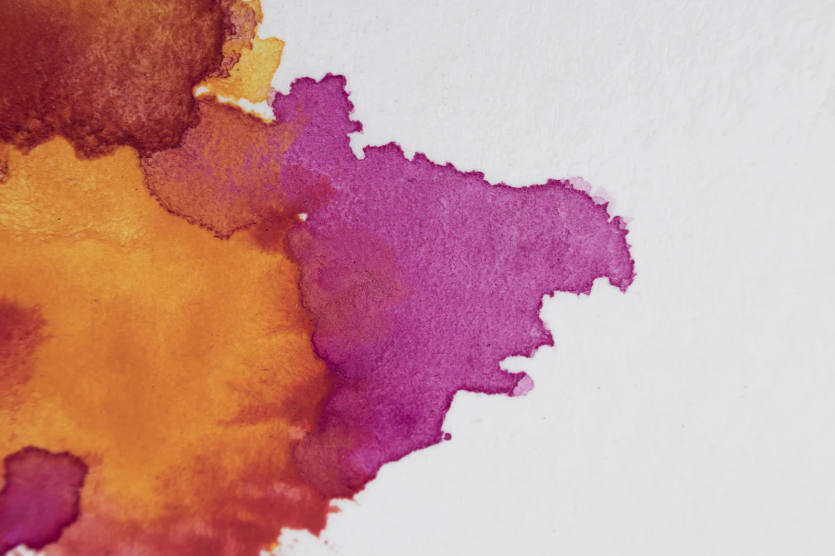 Vibrant purple and orange watercolor paint splashes
