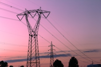 black electricity post under blue sky during daytime