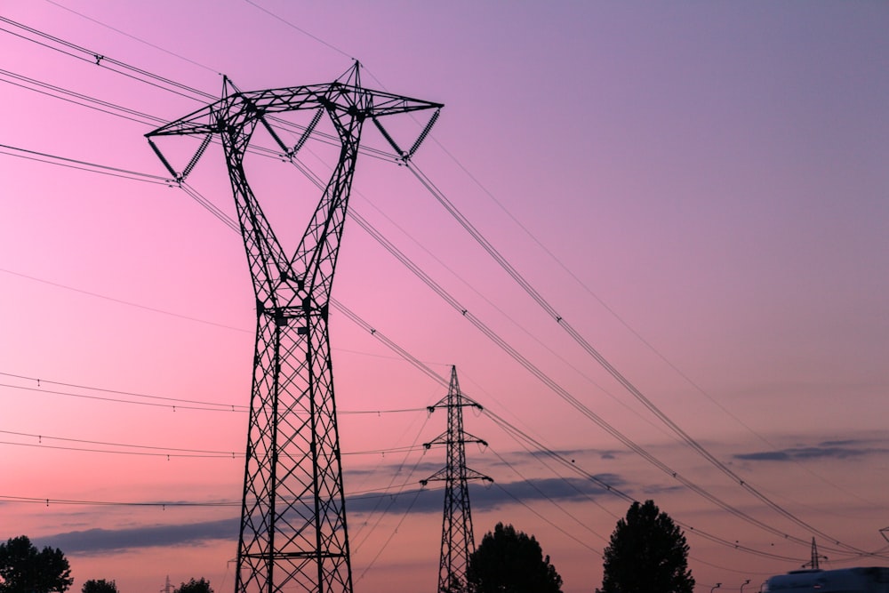 black electricity post under blue sky during daytime