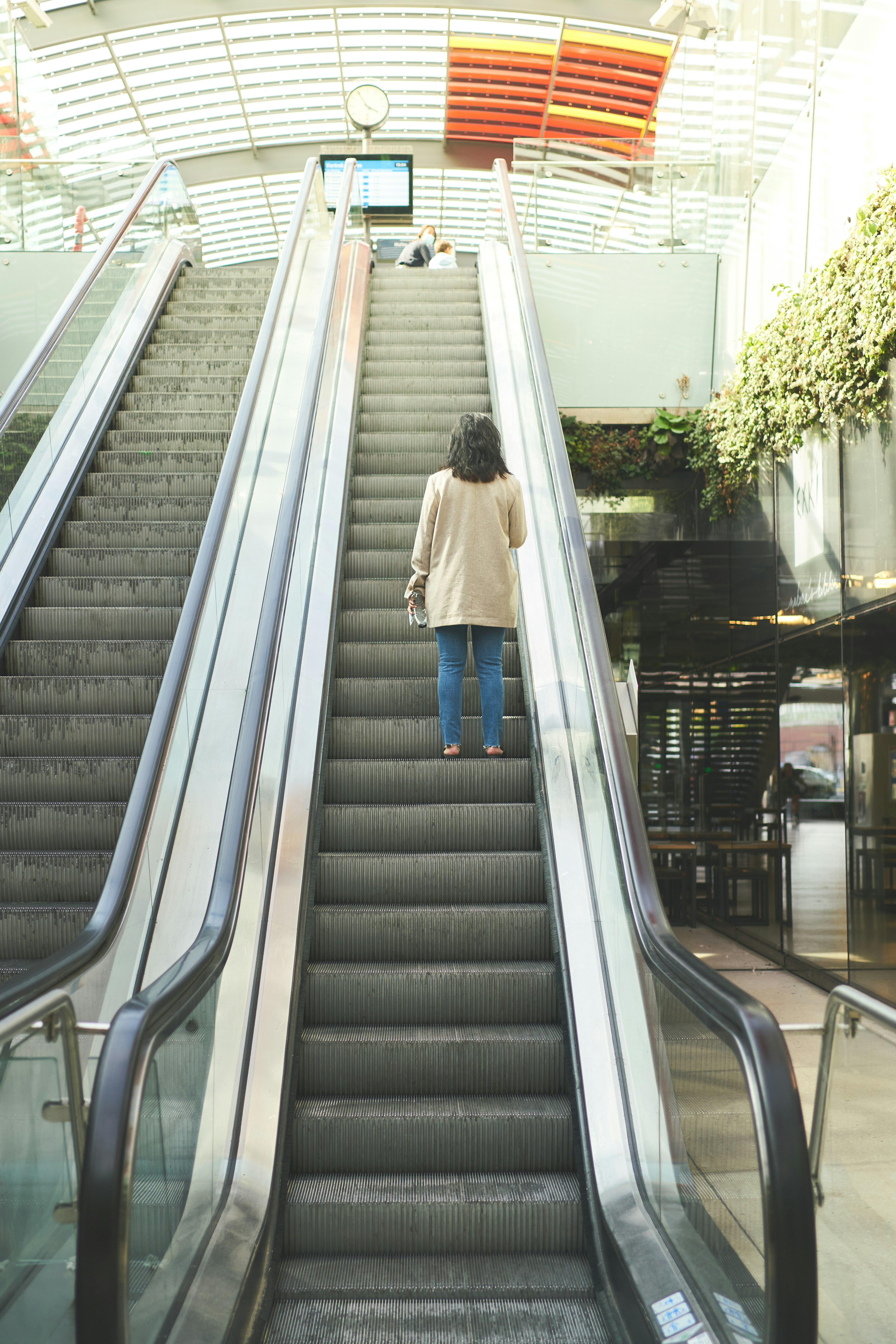 woman in white dress walking down the stairs