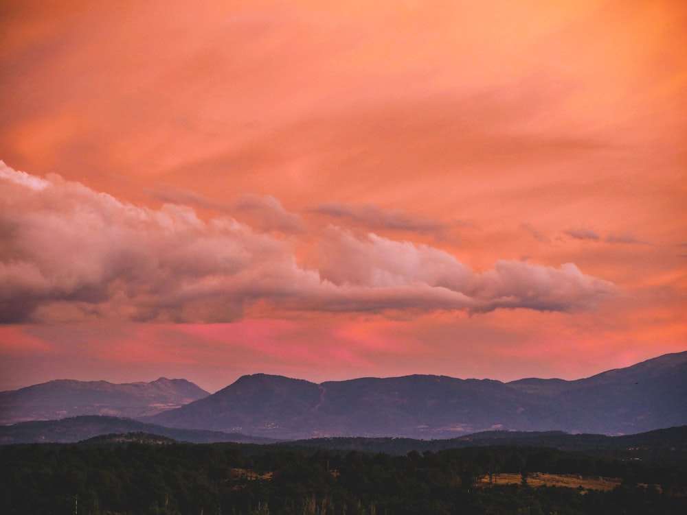 green mountains under white clouds during daytime