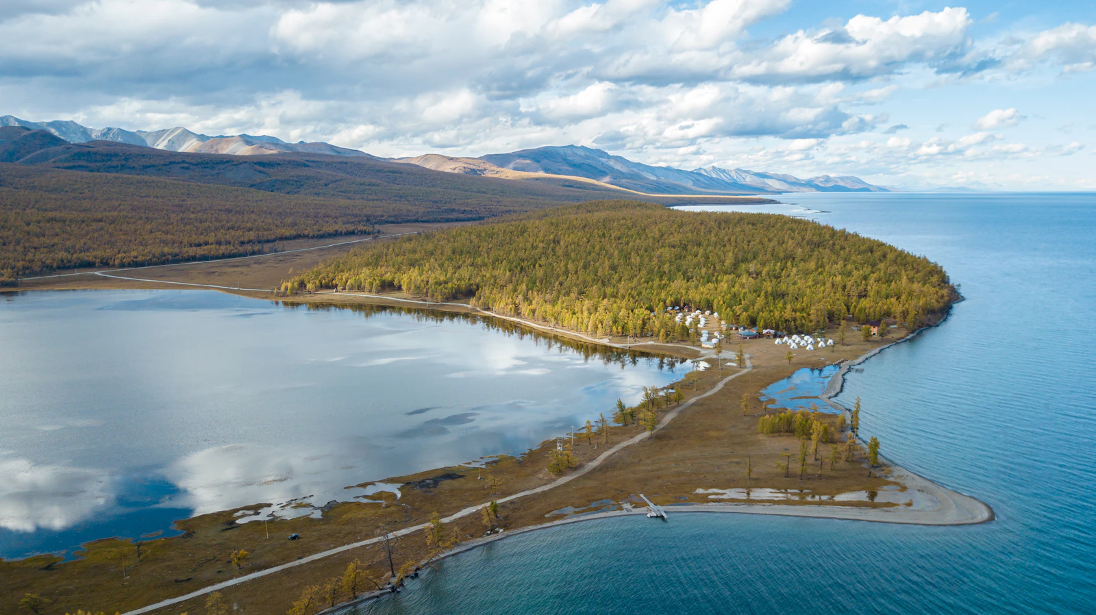 Lake Khövsgöl from above, larch forest along the shore and the water blue-green